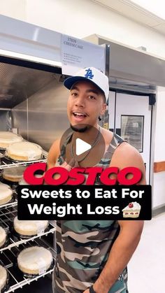 a man standing in front of an oven filled with doughnuts