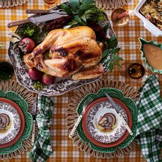 a turkey sitting on top of a table next to other dishes