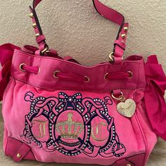 Amazing Juicy Bag In Excellent Condition! Has The Heart Charm With Bling. Super Iconic. Bling On The Bag. Soft Pink Velour. Minor Minor Minor Peeling In Some Of The Leather Areas. Overall This Bag Is Still 10/10 Condition Like The Item But Not The Price? Offers Are Always Accepted! Feel Free To Send An Offer Bundle 2+ Items & You Will Get Sent A Discounted Offer & You Will Save $ On Shipping Poshmark Ambassador Closet In Top Rated Seller Fast Shipping Average Same Day Smoke & Pet Free Home Luxury Recycled Packaging Hot Pink Juicy Couture, Juicy Bag, Mcbling Fashion, Pink Juicy Couture, Juicy Couture Purse, Purse Pink, Couture Handbags, Pink Bling, Juicy Couture Bags