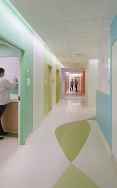 the hallway is clean and ready to be used by people in an office or school