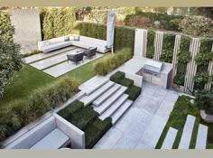 an outdoor living area with grass and plants on the walls, stairs to the roof