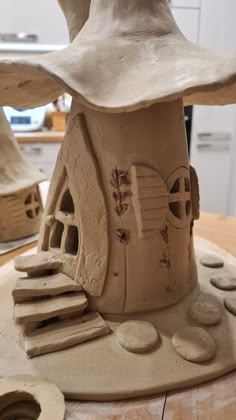 a clay house is sitting on a table