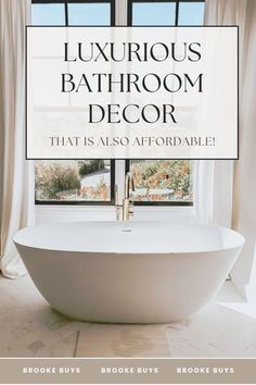 a white bath tub sitting next to a window in a bathroom with the words luxurious bathroom decor that is also available