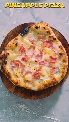 a pizza sitting on top of a wooden plate