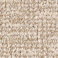 a beige carpet textured with white and brown colors, closeup view from above