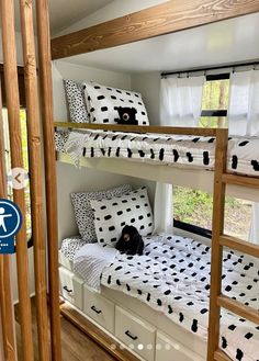 the bunk beds are decorated with black and white polka dots