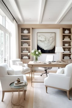 a living room filled with white furniture and lots of windows