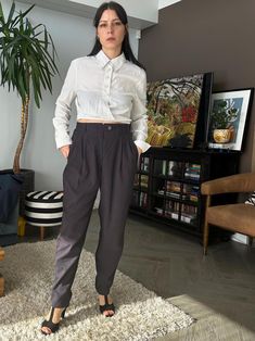 Vintage 90s women's pegged pleated front pants in navy blue, fabric is on a thicker side, pleasant on a skin. MATERIAL: 65% Cotton, 35% Viscose. CONDITION: Very good, color might be a bit washed off. SIZE AS ON THE LABEL: 42 GER. Model is 168cm tall, size S. For true to size guarantee check the MEASURMENTS: Waist 29.9" (76cm) / Hips 47.2" (120cm) / Length 40.2" (102cm) Each item is hand-picked, pre-used and vintage. If you have any questions, kindly reach out via message.    Visit my shop for mo Peg Trousers, 80s Women, Navy Women, Trousers Women, Navy Blue, Capri Pants, Pants For Women, Trousers, Relaxed Fit