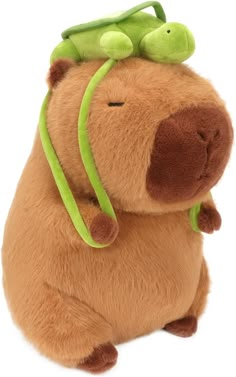 a stuffed animal with a green hat on it's head