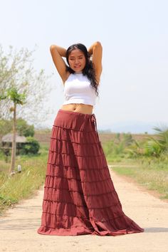 All items are shipped to Thailand Post . Free upgrade to D.H.L Express when you buy 2 or more items . The USA only. Please leave a phone number with orders. Full-length skirt in a beautiful soft cotton Boho style skirt with 10 tiers and 10 layers of ruffles all around and half lined. Drawstring waist with a small 7'' inch long zip. A great skirt to wear with a tight or cropped top. Easy to care for wash cold cycle, hang to dry or tumble dry low. Waist 33'' inches max ( drawstring ) Length 44'' i Red Tiered Skirt Bottoms For Beach, Red Long Skirt For Vacation, Casual Skirted Bottoms For Festival, Red Cotton Flared Skirt Bottoms, Bohemian Red Flared Skirt Bottoms, Brown Long Skirt For Vacation, Cotton Flared Skirt For Festivals, High Waist Bohemian Pleated Skirt, Casual Red Long Skirt