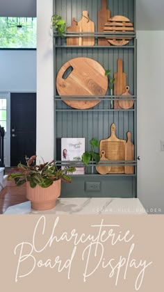 the shelves in this kitchen are filled with wooden cutting boards and cheese board designs on them