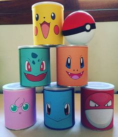 several different colored cans with cartoon faces on them