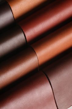 different colors of leathers are shown in this close up photo, including brown and tan