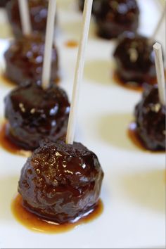 chocolate covered candies on sticks with caramel sauce