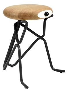 a wooden stool with black legs and an eyeball on the backrest, against a white background