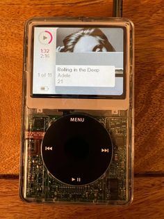 an mp3 player sitting on top of a wooden table