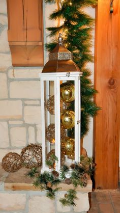 a white lantern with christmas decorations on it