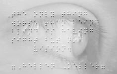 the words are made up of small white dots in front of a woman's face