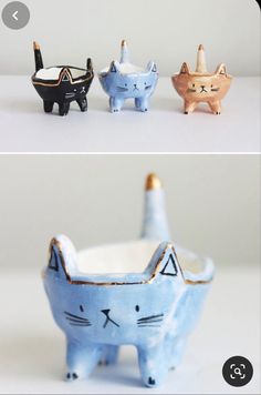 three ceramic cats sitting next to each other