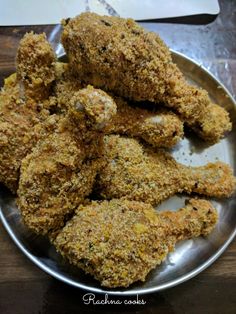 some fried food is on a silver plate and ready to be eaten by someone else