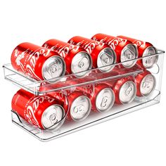 six cans of coca - cola are stacked on top of each other in a rack