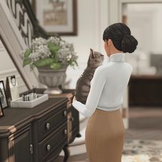 a woman holding a cat in front of a dresser with flowers on the top shelf