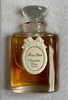 HAPPY TO RECEIVE REASONABLE OFFERS. Vintage CHRISTIAN DIOR ''Miss DIOR'' PARFUM 1/4 fl oz or 7.5 ml in original box. No cord, but has never been open, unused. Very rare. Number on the bottle 47566. Still smells very nice. Clear juice, no sediment, slight evaporation, about 95% left. The box is slightly damaged (see pix) Perfume bottle capacity: 7.5 ml, 1/4 fl oz Concentration: Pure Parfum Bottle height: 5 cm Bottle & stopper material: clear glass Year of first parfum release: 1947 (this particul Miss Dior 1947, Beautiful Bottles, Vintage Perfumes, Perfume Bottle, Dior Perfume, Perfume Bottle Design, Pretty Perfume Bottles, Vintage Cosmetics, Perfume Scents