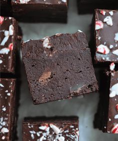 chocolate fudge brownies with white and red candy canes on top, ready to be eaten