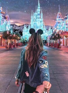 a person with long hair and mickey mouse ears on their head walking down the street