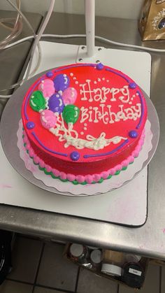 a birthday cake sitting on top of a table