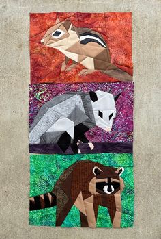 an animal quilt with four different animals on it's sides, including a raccoon and a badger