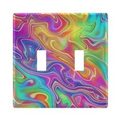 a multicolored light switch cover with an abstract design on the front and sides