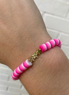 pink and white striped bracelet with gold stars