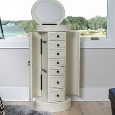 Number of Drawers: 7Included: 20 Necklace Hook(s)Features: Lift Top Lid, Felt-Lined Drawers, Quick ShipCompartments: 7Mounting Type: Free StandingTools Required: Screws (included)Measurements: 13.75 Depth/Inches, 18 Width/Inches, 41 Height/InchesWeight (lb.): 56 LbAssembly: Assembly RequiredBase Material: 100% WoodFinish: WhiteCare: Wipe CleanDecor Styles: TraditionalCountry of Origin: Imported White Jewelry Armoire, Jewelry Armoires, Jewelry Holders, Window Home Decor, Jewelry Armoire, White Jewelry, Queen B, Jewelry Organization, Locker Storage