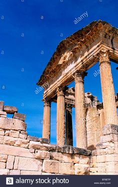 the ruins of an ancient roman city against a blue sky