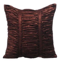 a brown pillow with ruffles on the front and back, against a white background