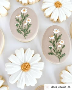 decorated cookies with flowers and leaves on them