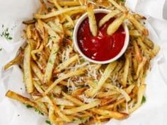 french fries with ketchup and parmesan cheese