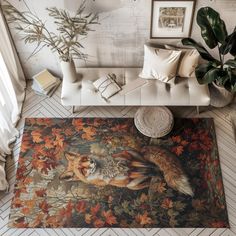 an overhead view of a living room with couches, rugs and pictures on the wall