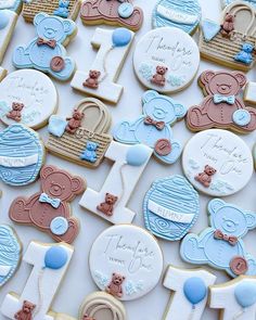 baby shower cookies are arranged on a table