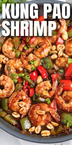 a skillet filled with shrimp, peppers and cashews on top of a white table