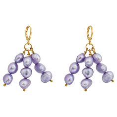 Called Igi meaning trees, these popular minimalist purple pearls are a must have member of your modern pearl collection. Lilac purple pearls have a beautiful shimmer and striking in nature yet lightweight to wear. DETAILS Brand: Ifemi Jewels Finding: Gold plated brass ear huggies Length: Less than 2 inches Colour: Lilac purple Product Materials: Gold plated brass ear huggies, a selection of freshwater pearls Sold as a pair. Ear Huggies, Purple Pearl, Freshwater Pearls Earrings, Pearl Collection, Lilac Purple, Fresh Water, Freshwater Pearls, Lilac, Violet