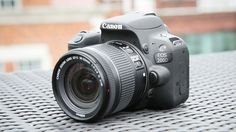 a canon camera sitting on top of a table