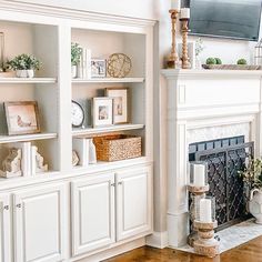 a living room filled with furniture and a flat screen tv mounted on the wall above a fire place