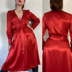 Deco Details. Stunning Vintage 1970's does 1930's Art Deco fiery rust red liquid rayon crepe satin wrap midi dress with plunging neckline, deco gathered yoke details and blouson sleeves. The color, the fabric, the details... she's a showstopper of a fireball.  Fits XS/S (I'm about a M), but please use measurements as fit guide. 13.5" shoulder  18.5" bust (on the half)  12.5"-13.5" waist for best wrap coverage (on the half)  18.75" hip (on the half)  23" sleeve  43.5-44" length estimate  Unlined Vintage Satin V-neck Dress, Vintage V-neck Midi Dress For Evening, Vintage V-neck Midi Dress For Wedding, Vintage Red Midi Dress For Evening, Red Satin Vintage Dress, Vintage Silk V-neck Dress, Dress With Plunging Neckline, Red Liquid, Best Wraps