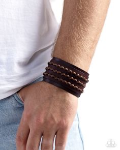 Rows of black leather laces twist as they are threaded through the center of a brown leather band that is studded across the front of a larger brown leather band for a rugged flair. Features an adjustable snap closure. Sold as one individual bracelet. Copper And Pink, Tassel Earing, Horseshoe Ring, Dainty Band, Coil Bracelet, Brown Bracelet, Snap Bracelets, Bow Necklace, Rugged Style