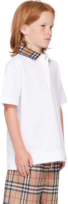 Organic cotton piqué polo. · Check pattern at knit spread collar · Three-button placket · Logo embroidered at front · Tennis-tail hem · Machine-wash Supplier color: White Model measures 48 / 121.9 cm tall and wears size 8Y. Burberry Size: child's height 3Y: 38.5 / 98 cm 4Y: 41 / 104 cm 6Y: 45.5 / 115.5 cm 8Y: 50.4 / 128 cm 10Y: 55.1 / 140 cm 12Y: 59.9 / 152 cm 14Y: 64.6 / 164 cm Burberry Kids Backpack, Burberry Baby Clothes, Burberry Childrenswear, White Polo Collar T-shirt With Embroidered Logo, Kids Polo T-shirt, Burberry Kids, Check Pattern, Logo Embroidered, Button Placket