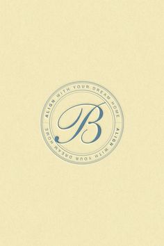 the letter b is inscribed in blue on a cream colored background with a circular logo