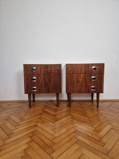 two wooden drawers sitting on top of a hard wood floor