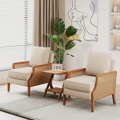 a living room with two chairs and a table in front of a painting on the wall